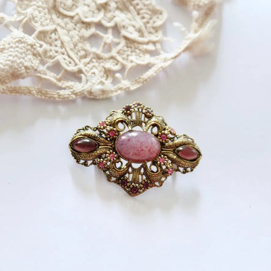 Broche vintage métal doré filigrane cabochon rose