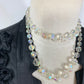 Collier vintage deux rangs perles en verre transparentes à reflets et facettes